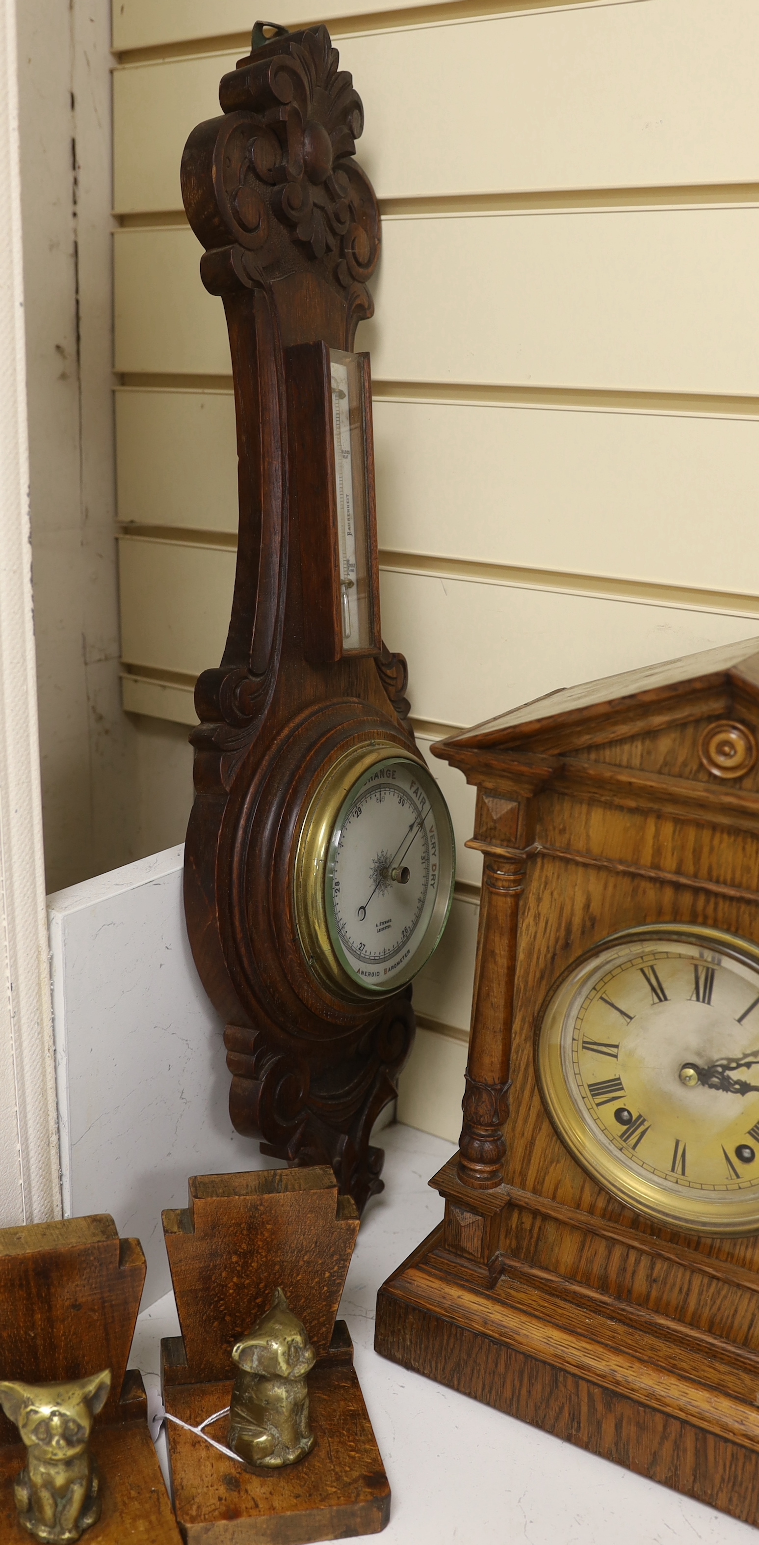 Woodenware including Art Deco bookends, a Black Forest Winterhalder and Hofmeier clock striking on a coiled gong and an aneroid barometer, clock 38cm